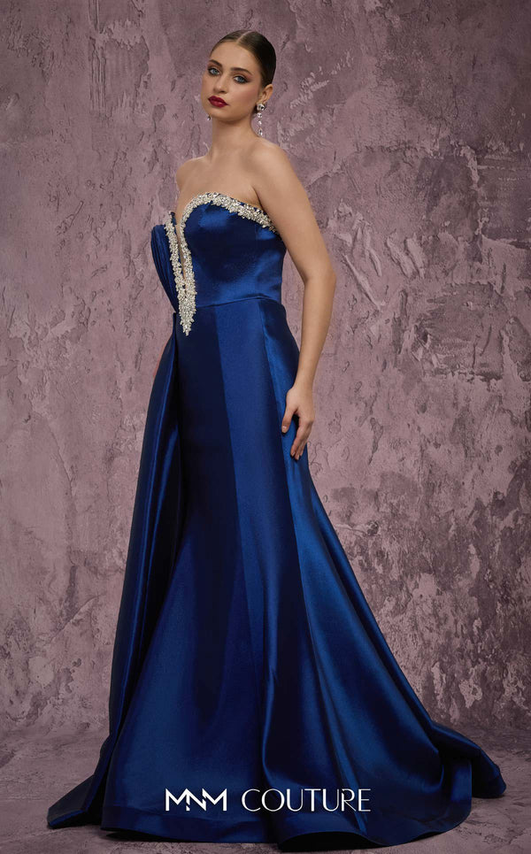 MNM Couture Style Q2414 mermaid gown with a deep V-neckline, embellished bodice, and side train. \ Couture Shop LA