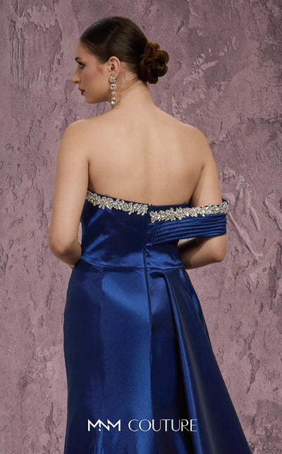 MNM Couture Style Q2414 mermaid gown with a deep V-neckline, embellished bodice, and side train. \ Couture Shop LA