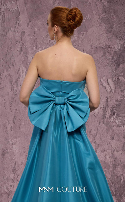 MNM Couture Style Q5574 strapless mermaid gown with rhinestone embellishments and a bow train. \ Couture Shop LA