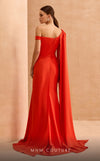 MNM Couture V02029 asymmetrical gown with a long cape skirt and crystal, rhinetones and beads-embellished brooch from waist down to open side slit. | Couture Shop LA