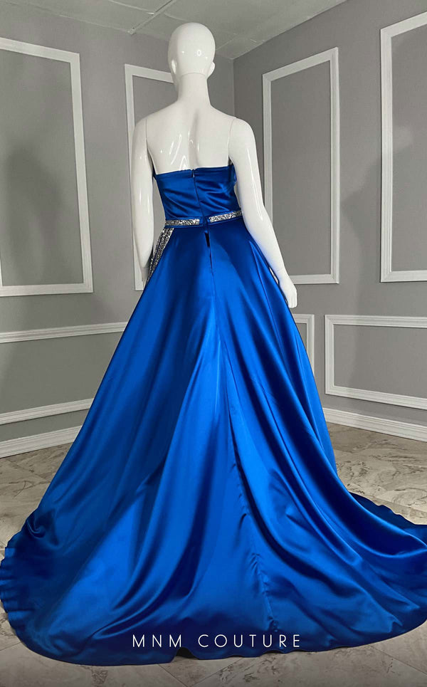 MNM Couture V07353 asymetric sleevless satin column gown with ruffles and beadwork. | Couture Shop LA