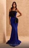 Designer MNM Couture V07391 asymmetric bow mermaid gown with rhinestones.