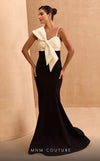 MNM Couture V07400 mermaid gown with spaghetti straps and a dramatic bow.