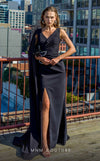 MNM Couture V07523 black column gown with rayon crepe, cape sleeve, and rhinestone brooch accents.| Couture Shop LA