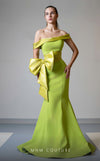 MNM Couture V07546 off-shoulder mermaid gown with a dramatic bow.