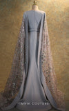 GLAM by MNM Couture V6463 grey gown with embroidered cape sleeves and pleated bodice | Couture Shop LA