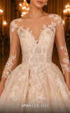 MNM Couture W2105 ball gown with sheer sleeves and lace applique detailing. | Couture Shop LA