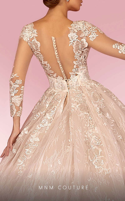 MNM Couture W2105 ball gown with sheer sleeves and lace applique detailing. | Couture Shop LA