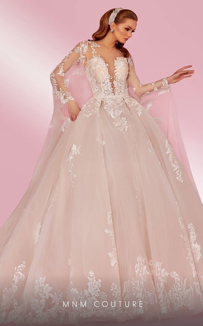 MNM Couture W2108 princess gown with removable tulle cape, lace appliques, and deep V-neckline details. | Couture Shop LA