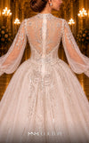 MNM Couture W2117 princess gown with puffed sleeves, shiny tulle, and beaded accents. | Couture Shop LA