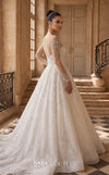 MNM Couture W2310 white ball gown wedding dress with rounded illusion bateau neckline, long sheer sleeves scattered with pearls and crystals, ultra-dense beaded sweetheart bodice, crystal button and corset lace-up back with ribbon bow, and shimmer tulle skirt with cathedral train | Couture Shop LA