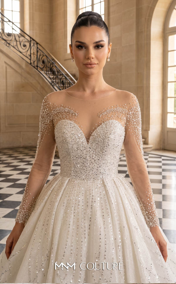 MNM Couture W2310 white ball gown wedding dress with rounded illusion bateau neckline, long sheer sleeves scattered with pearls and crystals, ultra-dense beaded sweetheart bodice, crystal button and corset lace-up back with ribbon bow, and shimmer tulle skirt with cathedral train | Couture Shop LA