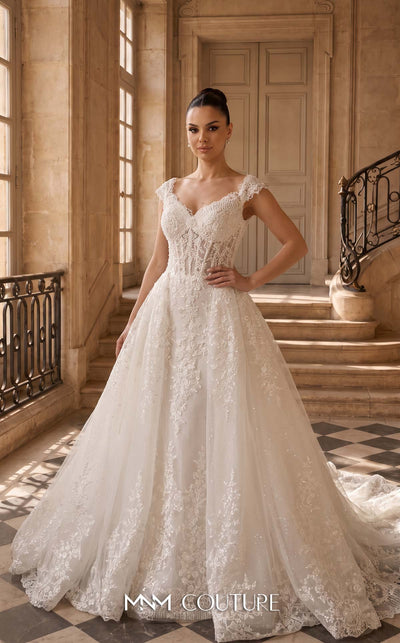 MNM Couture W2314 white off-shoulder ball gown wedding dress with structured flat shoulder drapes, pearl-beaded lace sweetheart bodice, 3D floral appliqués massed at the hem, corset lace-up back, and separate back overskirt with cathedral train | Couture Shop LA